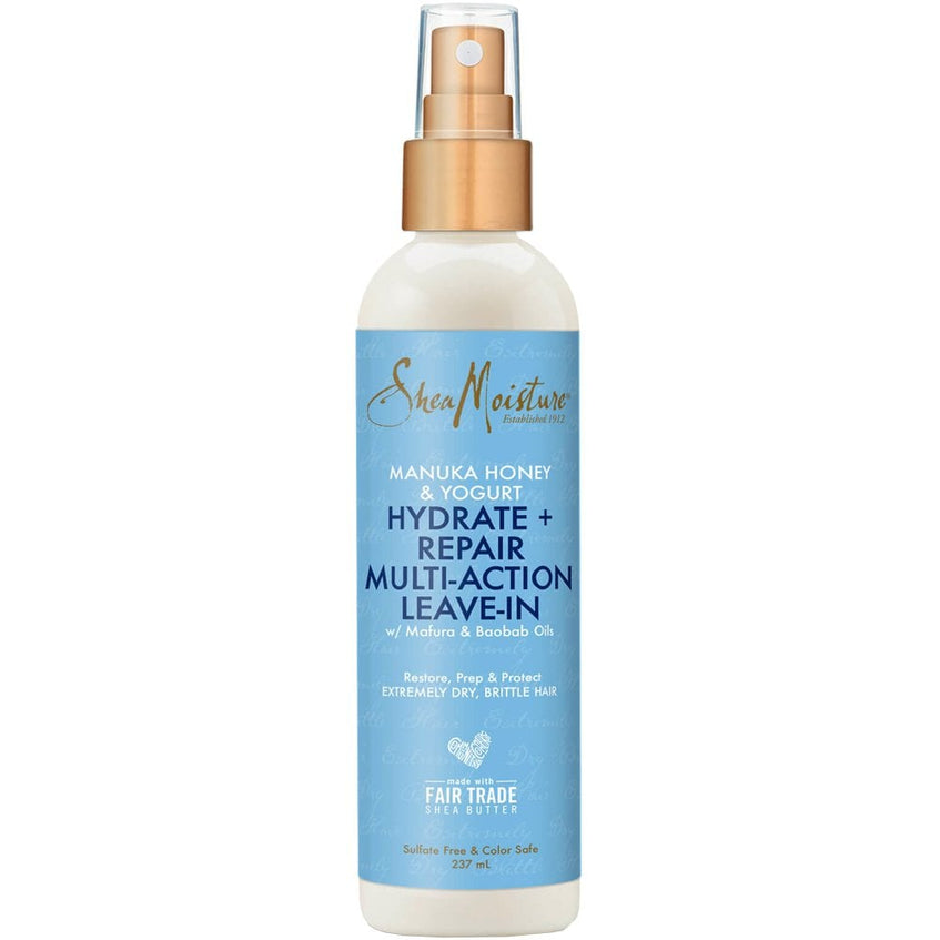SheaMoisture Manuka Honey & Yogurt Hydrate + Repair Multi-Action Leave-In hair care spray bottle with a light blue label and gold spray top, shown on a white background.