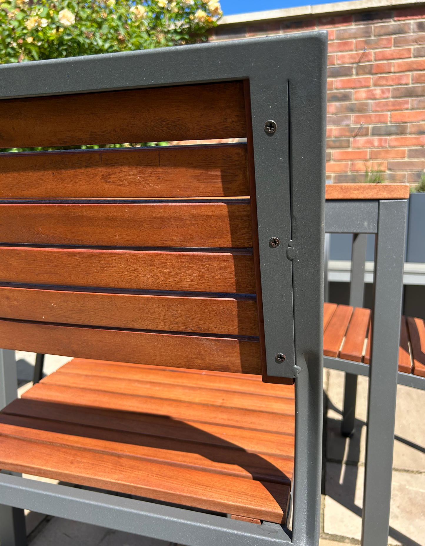 a close-up on the back of an outdoor chair from the set