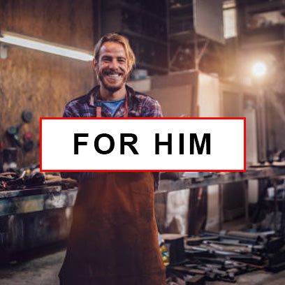 for him section - a smiling guy standing in his workshop