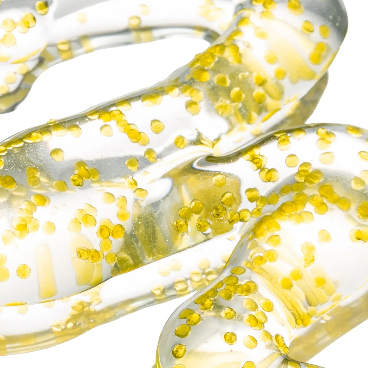 A close-up of a transparent, gel-like product with many small yellow circular inclusions, shown on a white background.