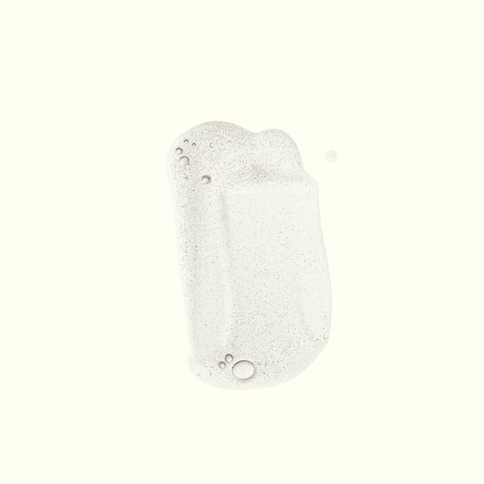 Aesop soap foam with small bubble details, centered on a solid off-white background.