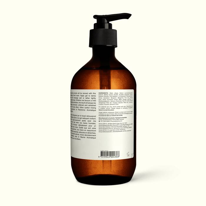 Brown Aesop hand wash bottle with pump and white label on a white background