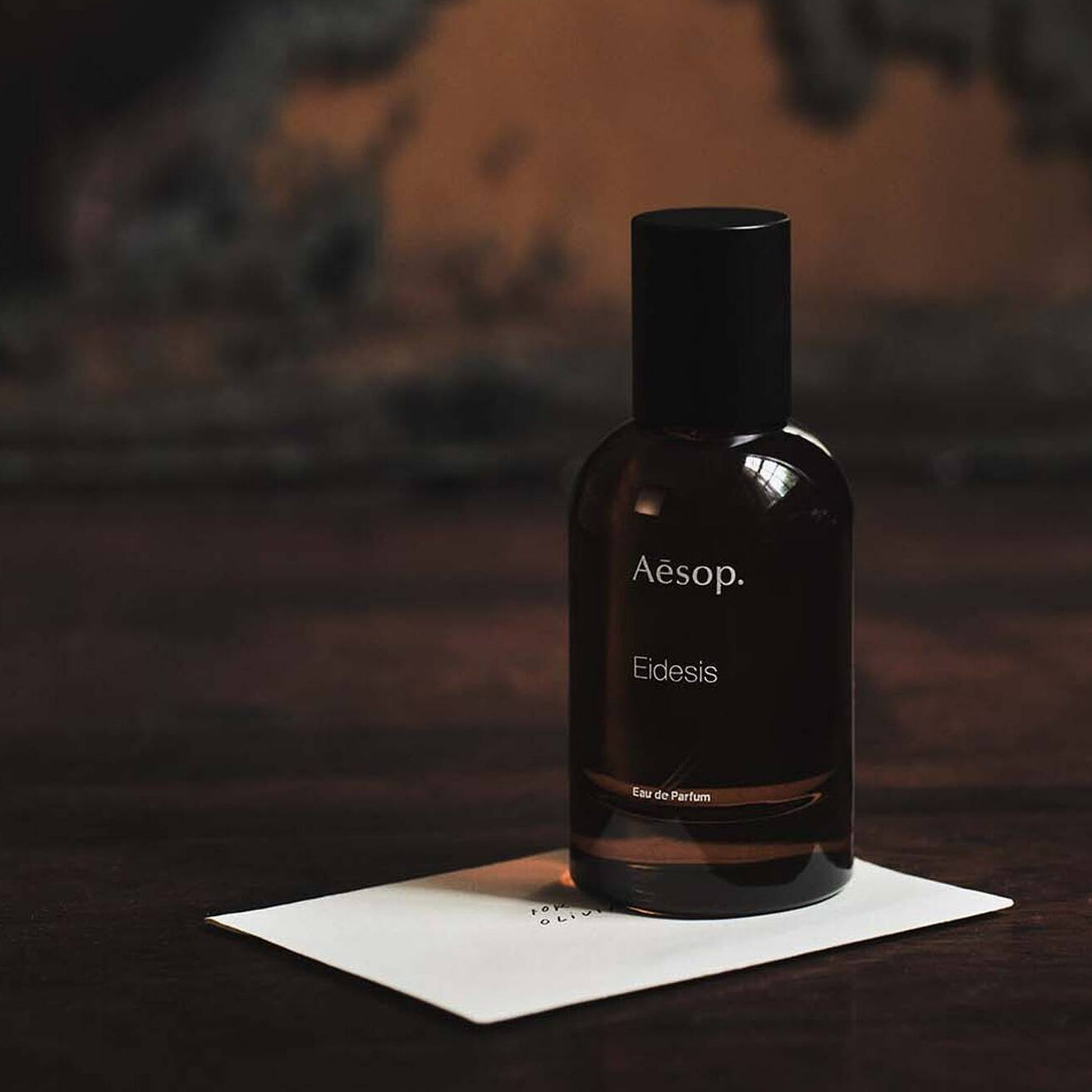 Aesop bottle on a dark background