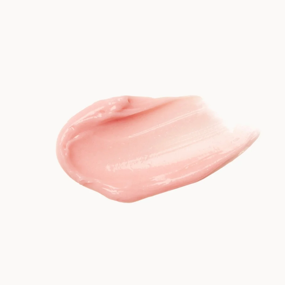 Pink cosmetic cream swatch on a white background