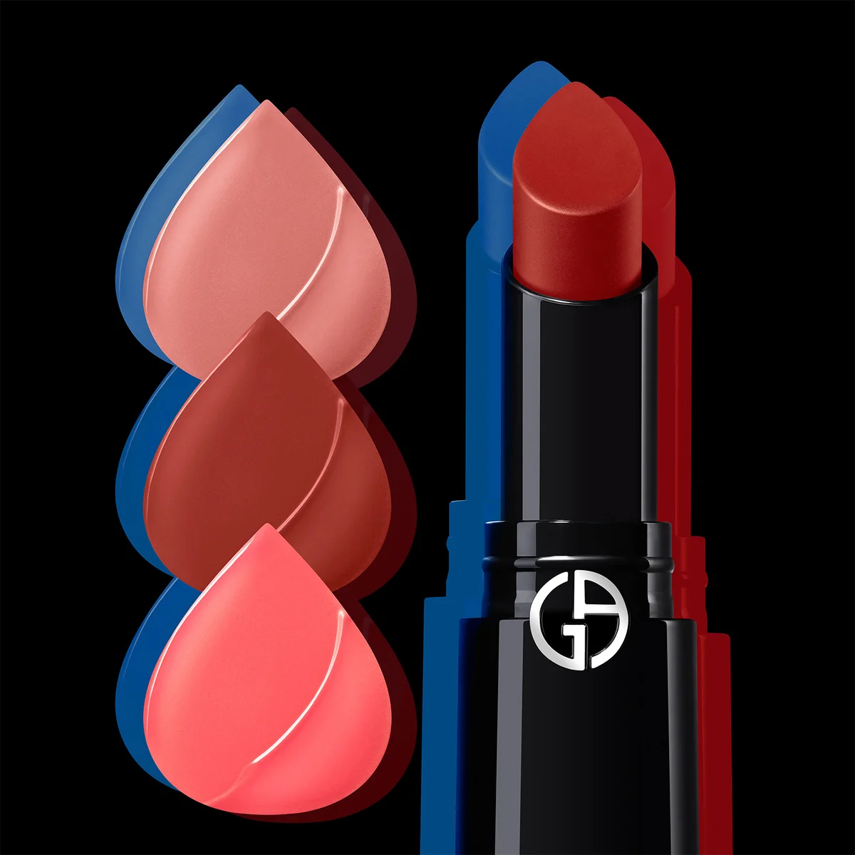 An open Giorgio Armani lipstick in a black tube with a silver logo, shown next to three teardrop-shaped color swatches in pink, terracotta, and coral shades against a black background.