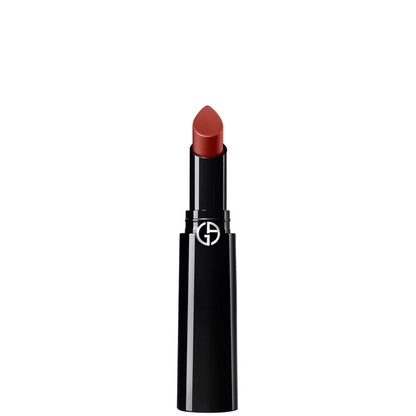 A single tube of lipstick with a black casing and a warm reddish-brown lipstick bullet, shown against a plain white background. The brand logo is visible on the tube.