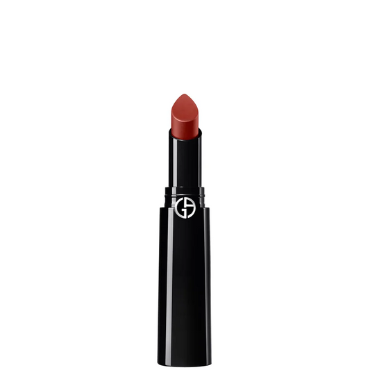 A single tube of lipstick with a black casing and a warm reddish-brown lipstick bullet, shown against a plain white background. The brand logo is visible on the tube.