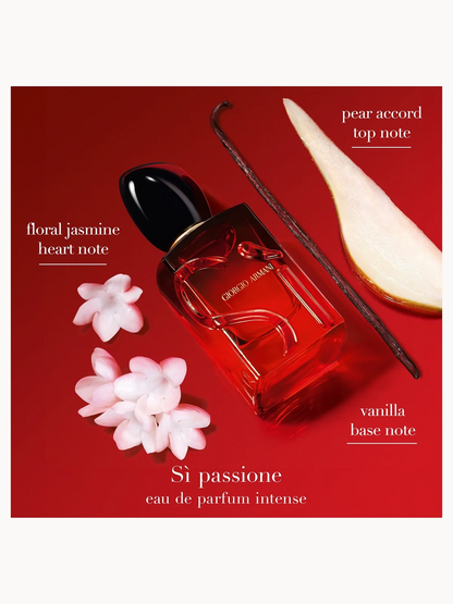 Red Armani perfume bottle with floral elements on a red background