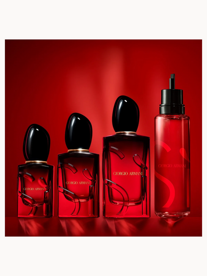 Set of Giorgio Armani perfume bottles on a red background
