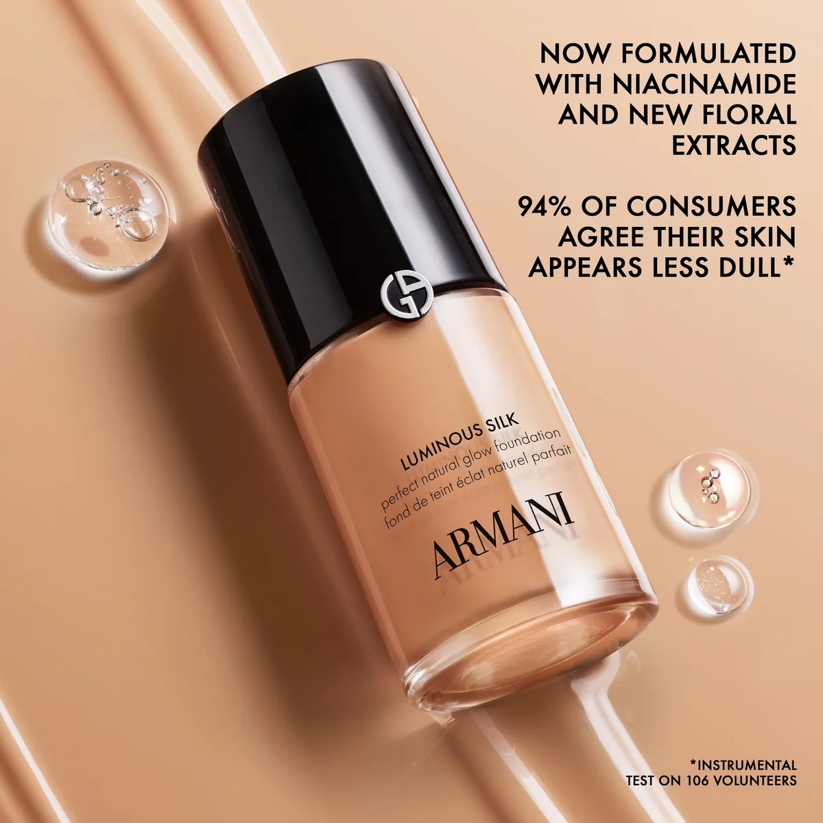 Armani foundation bottle with dropper on a beige background