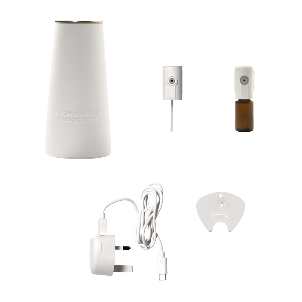 White essential oil diffuser set with accessories on a white background