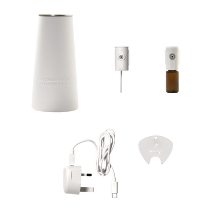 White essential oil diffuser set with accessories on a white background