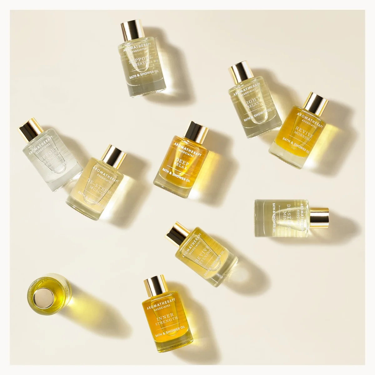 Collection of various bottles on a light beige background
