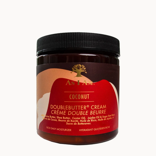 A jar of As I Am Coconut Doublebutter Cream on a solid white background. The product is in a dark amber-brown jar with a black ribbed screw cap and a red and beige label featuring gold text and logo.