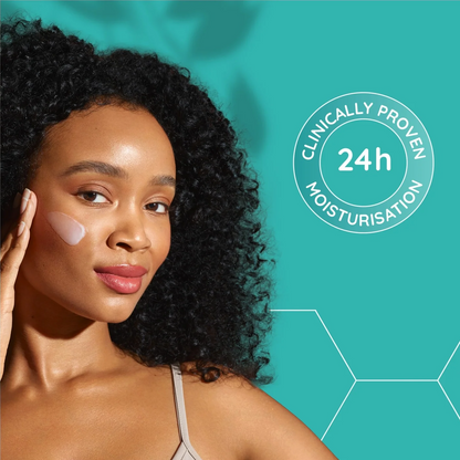 A woman with curly black hair applies a light cream product to her cheek against a teal background with white text reading 'Clinically Proven 24h Moisturisation'.