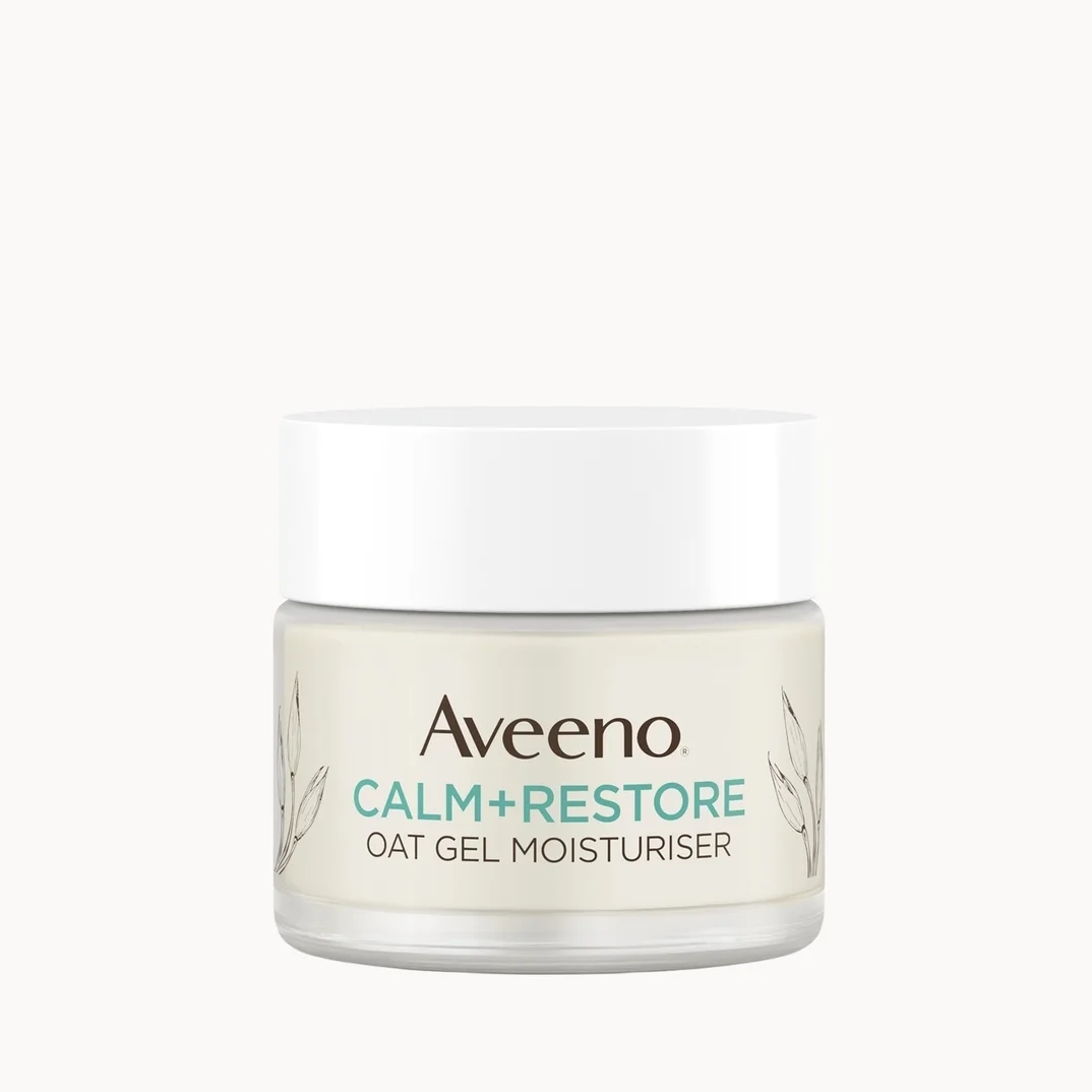 Aveeno Calm+Restore Oat Gel Moisturiser in a clear jar with a white lid, centered on a solid off-white background.