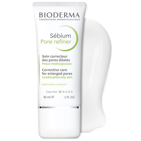 Bioderma Sébium Pore Refiner corrective care tube for enlarged pores, shown in white with green and black text, alongside a white silicone pore-shaped applicator on a clean white background.