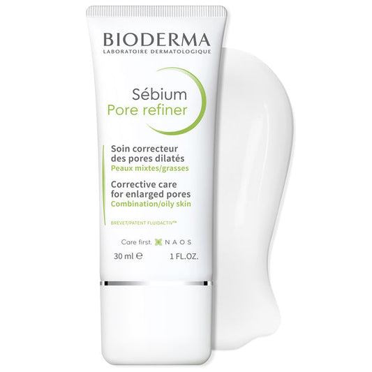 Bioderma Sébium Pore Refiner corrective care tube for enlarged pores, shown in white with green and black text, alongside a white silicone pore-shaped applicator on a clean white background.