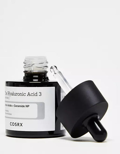 Cosrx skincare product with dropper on a white background