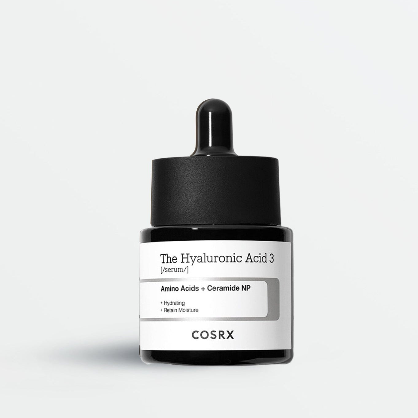 Cosrx skincare product with dropper on a light gray background