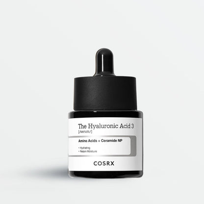 Cosrx skincare product with dropper on a light gray background