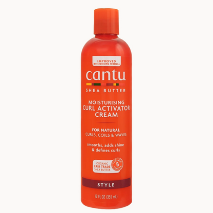 A bottle of Cantu Shea Butter Moisturising Curl Activator Cream in a vibrant orange-red color, shown against a plain light gray background.
