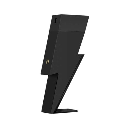 A black lightning-bolt-shaped Carolina Herrera Bad Boy Eau de Parfum on a solid white background, featuring a small gold stylized 'H' logo on the side.