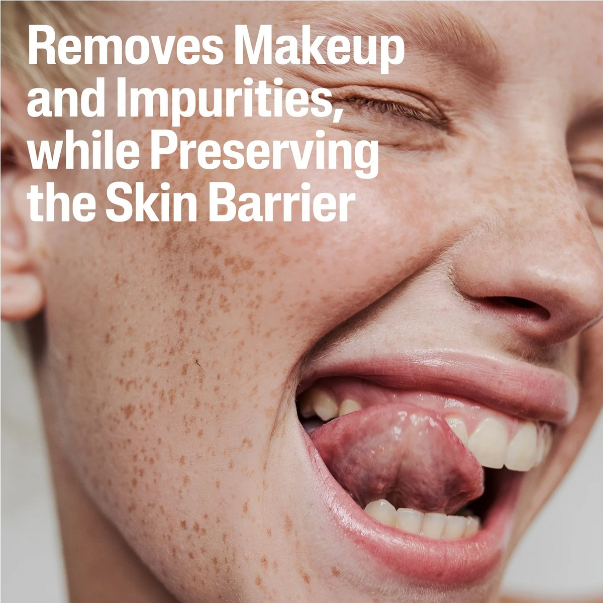 A close-up of a smiling person's face with large white text overlaid that reads, 'Removes Makeup and Impurities, while Preserving the Skin Barrier.' The image appears to be a promotional or informational graphic rather than a clean product shot, and no specific physical product is visible.