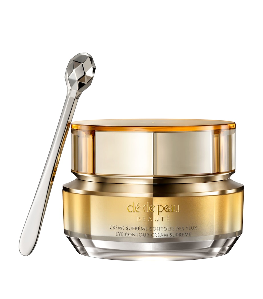 Anti ageing creme cosmetic jar with a spoon on a white background