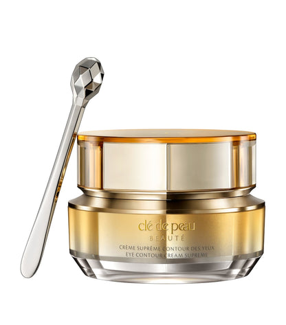 Anti ageing creme cosmetic jar with a spoon on a white background