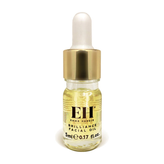 Bottle of Emma Hardie Brilliance Facial Oil with dropper on a white background