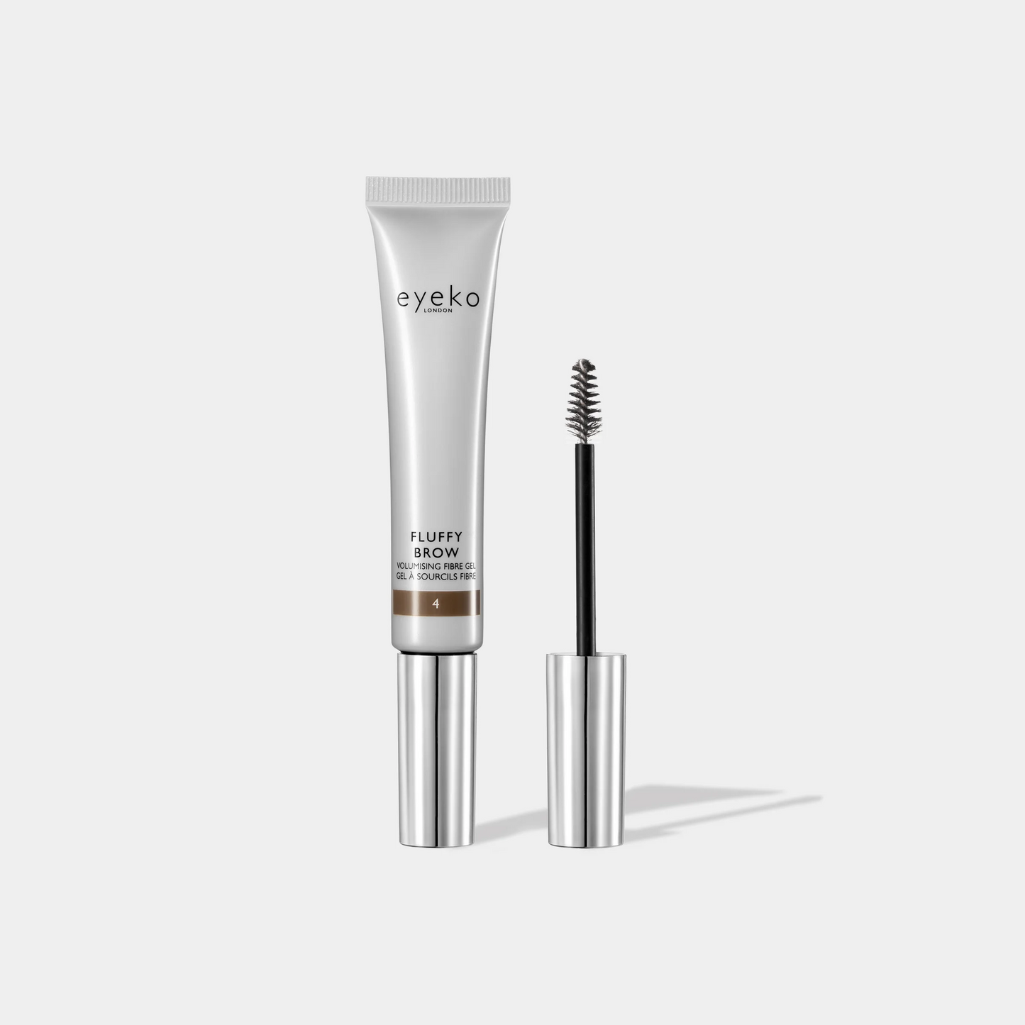 Eyeko Fluffy Brow product with applicator on a white background
