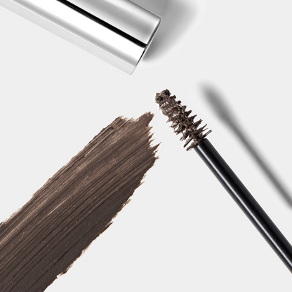 Eyebrow pencil with brown color swatch on a white background