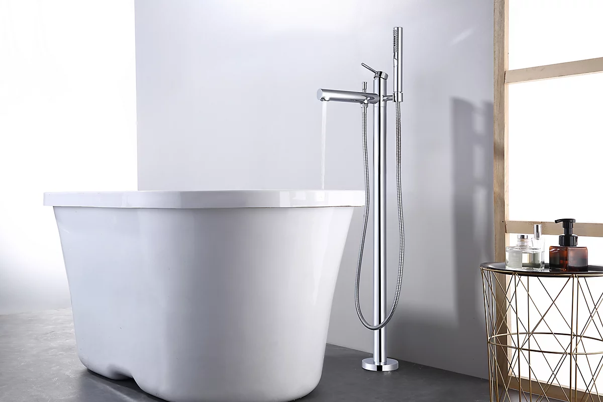 Modern freestanding bathtub with chrome faucet in a bathroom setting