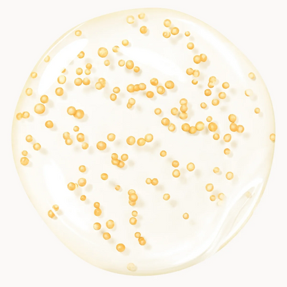 Clear gel with gold beads on a white background