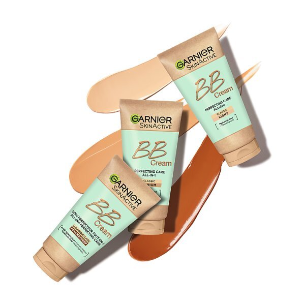 Three tubes of Garnier Skinactive BB Cream in Classic Tan, Clay, and Sand shades are arranged diagonally on a white background with corresponding liquid swatches.