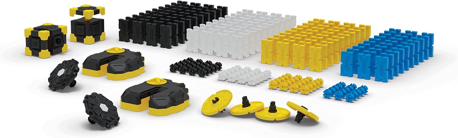 Assorted toy building block pieces in black, yellow, and blue on a white background