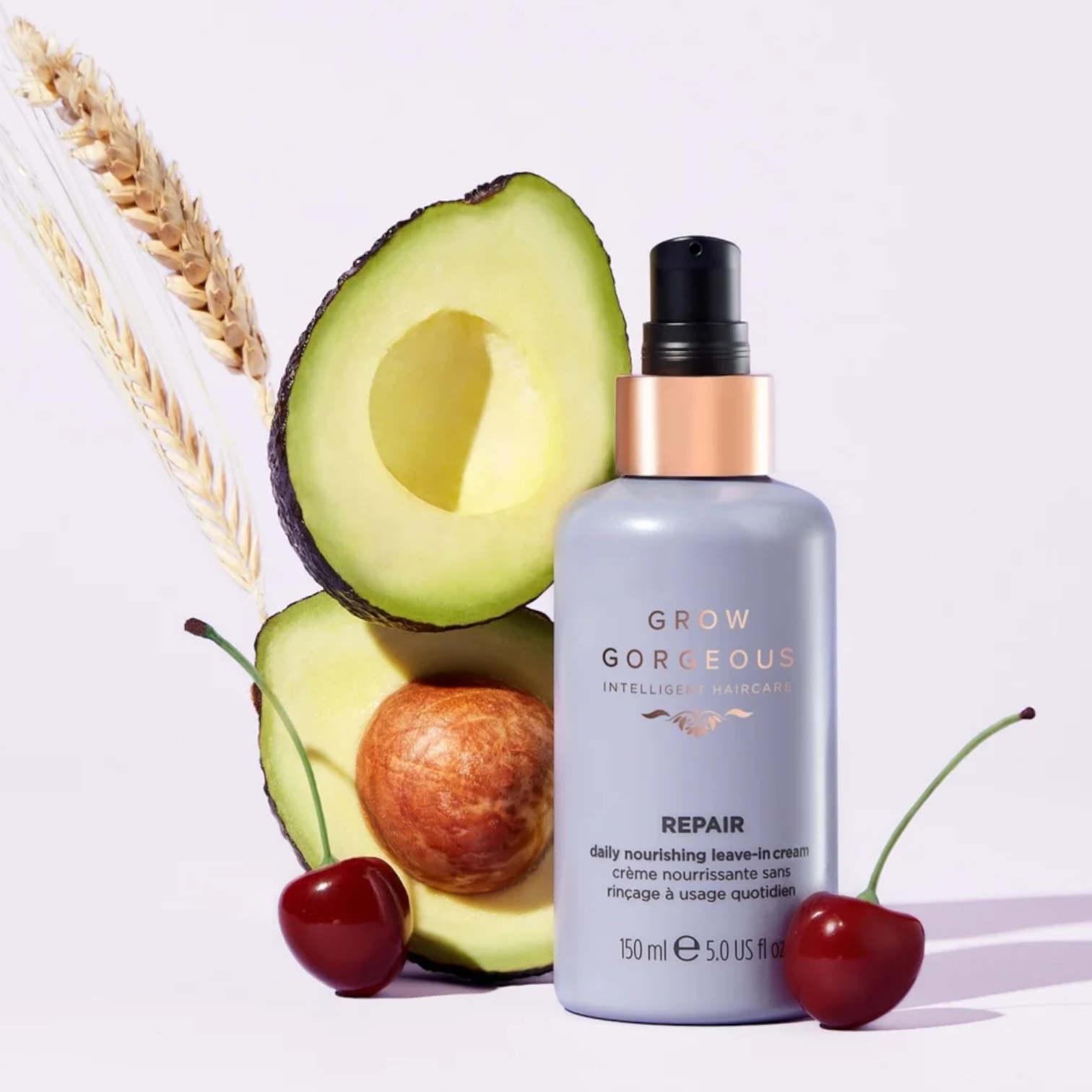 Haircare bottle labeled 'Grow Gorgeous' with an avocado and cherries on a light background