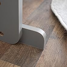 Gray furniture leg on a wooden floor