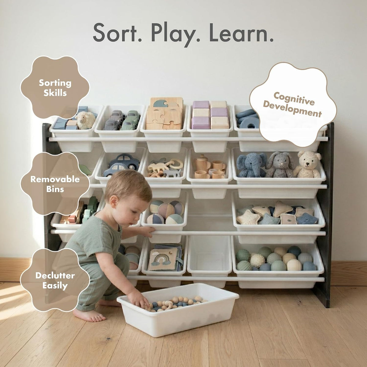 Child playing with a toy storage system labeled 'Sort. Play. Learn.'