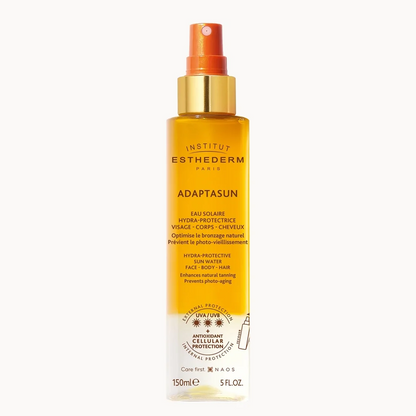 Institut Esthederm Adaptasun sunscreen spray bottle on a white background