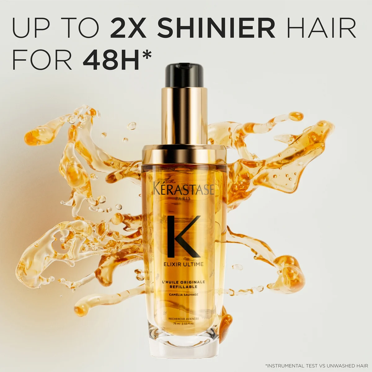 Kérastase Elixir Ultime hair serum with liquid splash on a light background