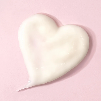 Heart-shaped night mask product sample on a pink background