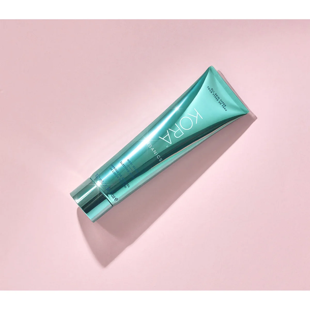 Kora Organics tube on a pink background