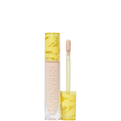 Kosas liquid concealer in a clear tube with a yellow patterned cap, shown next to its applicator wand on a white background.