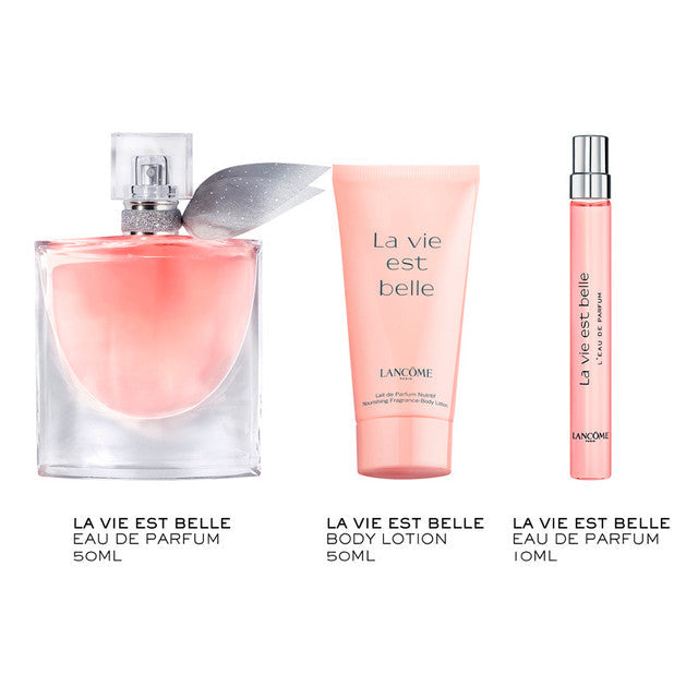 Three La Vie Est Belle fragrance/body care items from Lancome arranged on a white background: a 50ml perfume bottle, a 50ml body lotion tube, and a 10ml travel spray vial. The products are shown with French text labels beneath them.