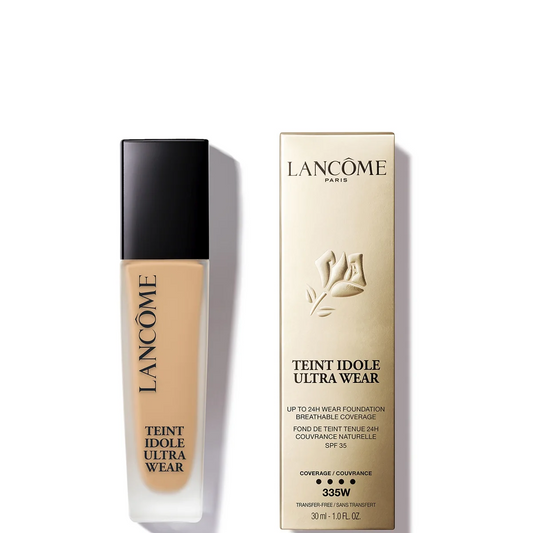 Lancôme Teint Idole Ultra Wear foundation in a clear bottle showing the beige liquid, next to its beige packaging box on a white background.