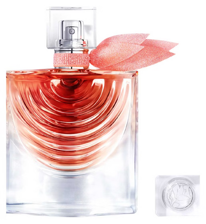 Perfume bottle with a pink flower on a white background
