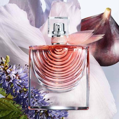 Perfume bottle with floral and fig background