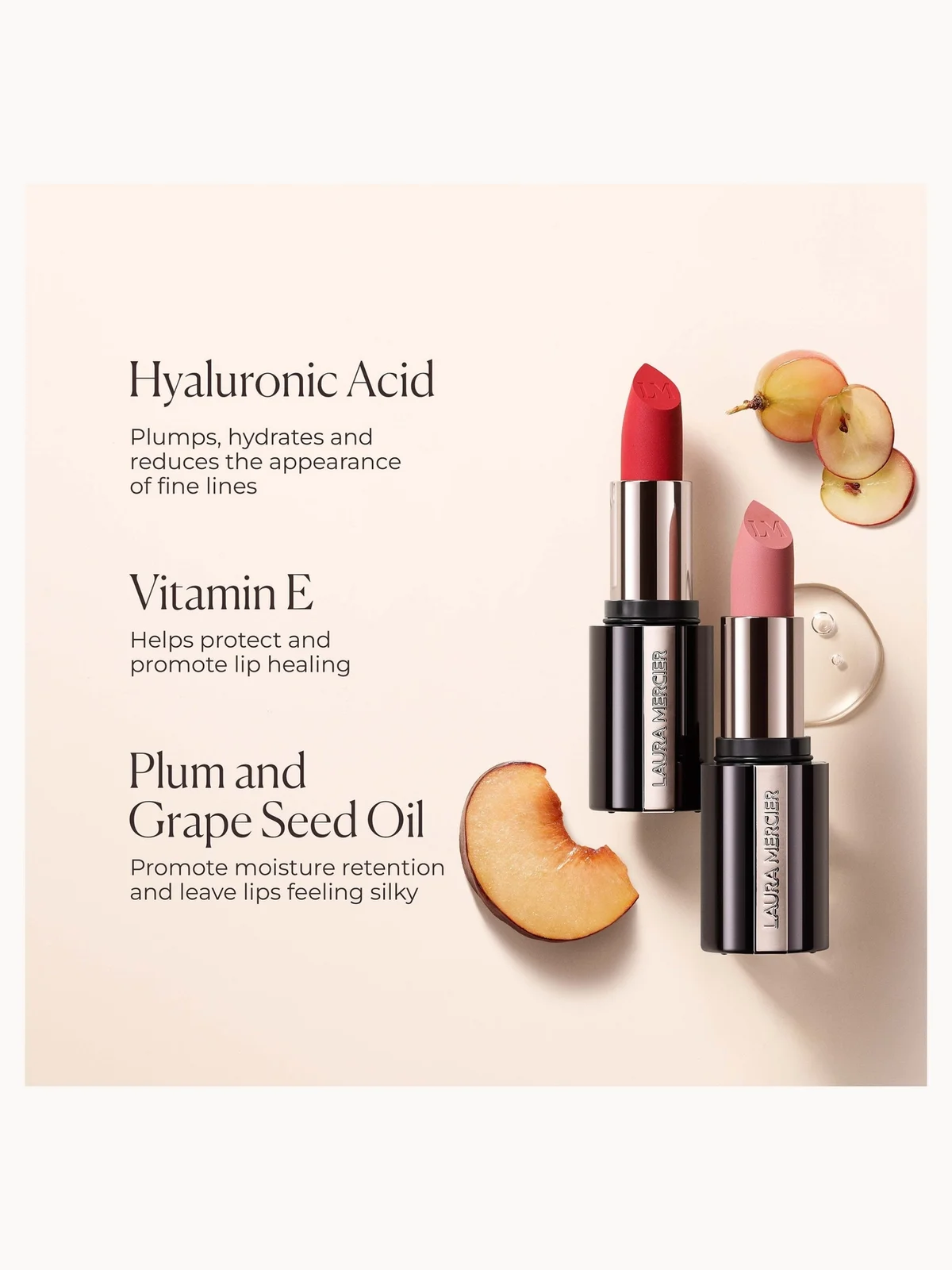 Two Laura Mercier lipsticks, one red and one pink, displayed on a light beige background with text describing key ingredients: Hyaluronic Acid, Vitamin E, and Plum and Grape Seed Oil. Sliced peaches and a small round cosmetic dish are styled as props.